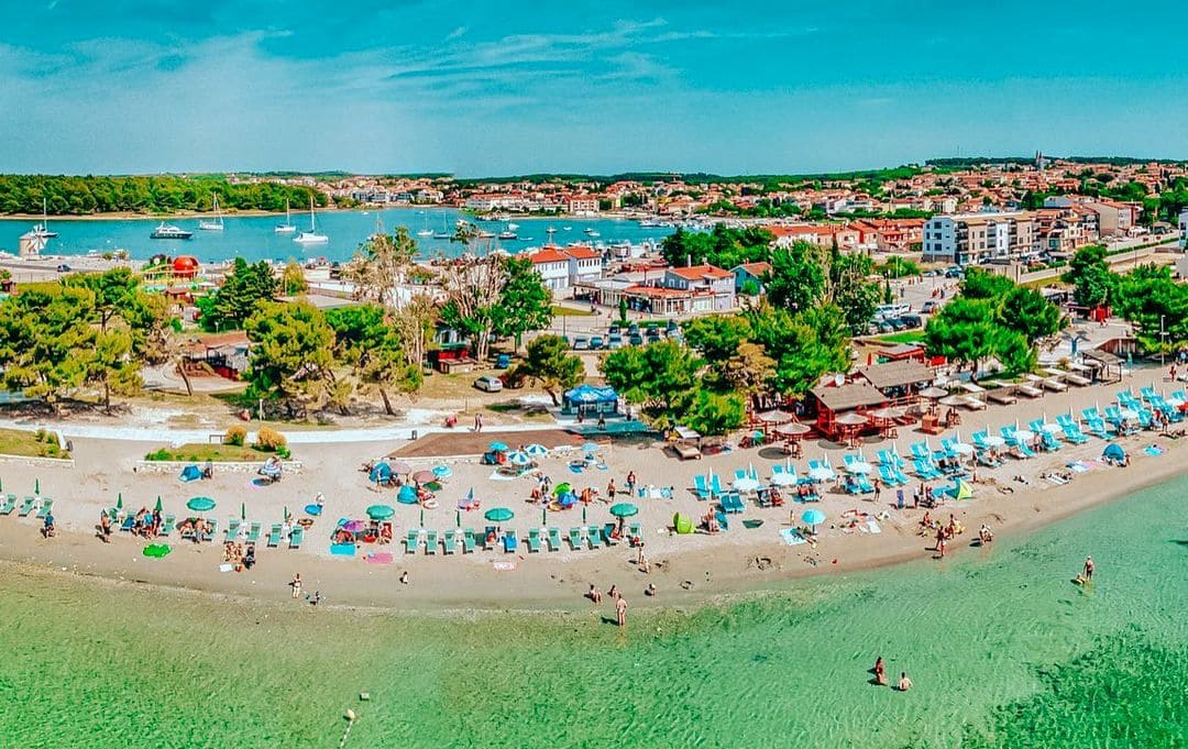 Shallow waters at Bijeca Beach, perfect for kids in Croatia