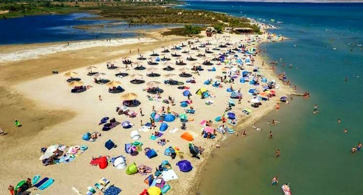 Family enjoying the soft sand at Queen's Beach in Croatia