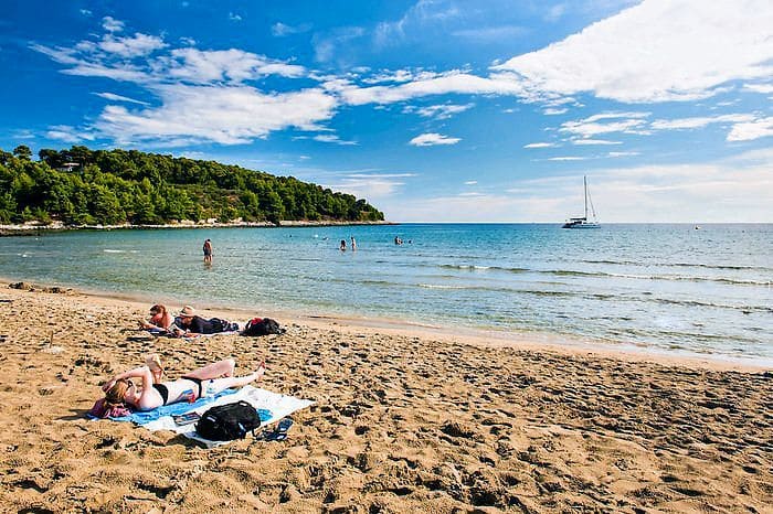 Clear blue water at Vela Przina Beach, a must-see in Croatia