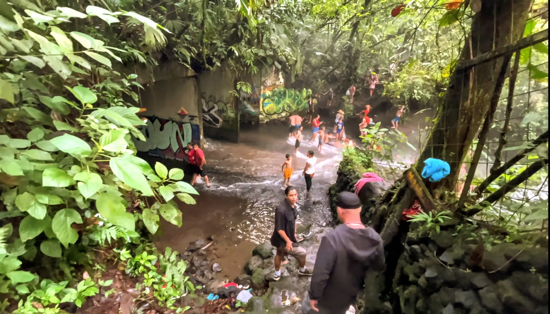 Arenal Volcano towering above lush greenery and serene hot springs in Costa Rica