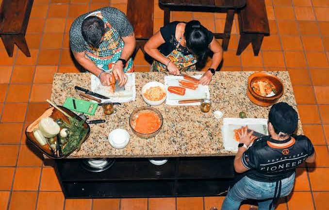 Hands preparing traditional Costa Rican dishes in a cooking class