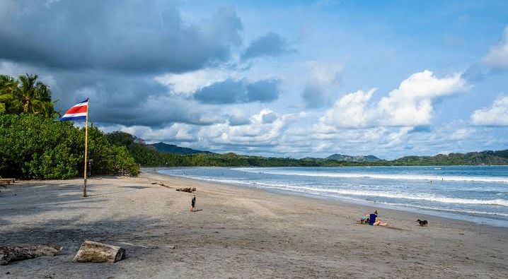 Scenic view of Playa Samara, Costa Rica, with golden sand and blue green waters