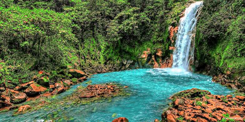 Beautiful hidden waterfall surrounded by lush jungle near Samara